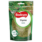 A green and clear package of Bodrum - Thyme - 50g, labeled “100% natural” with “Kekik,” features thyme leaf images and highlights this Mediterranean herb as premium quality thyme.